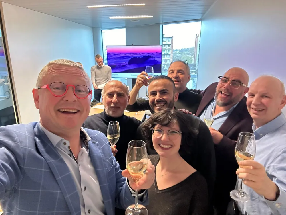 The new TMS management team raising a glass after signing the management buy-out